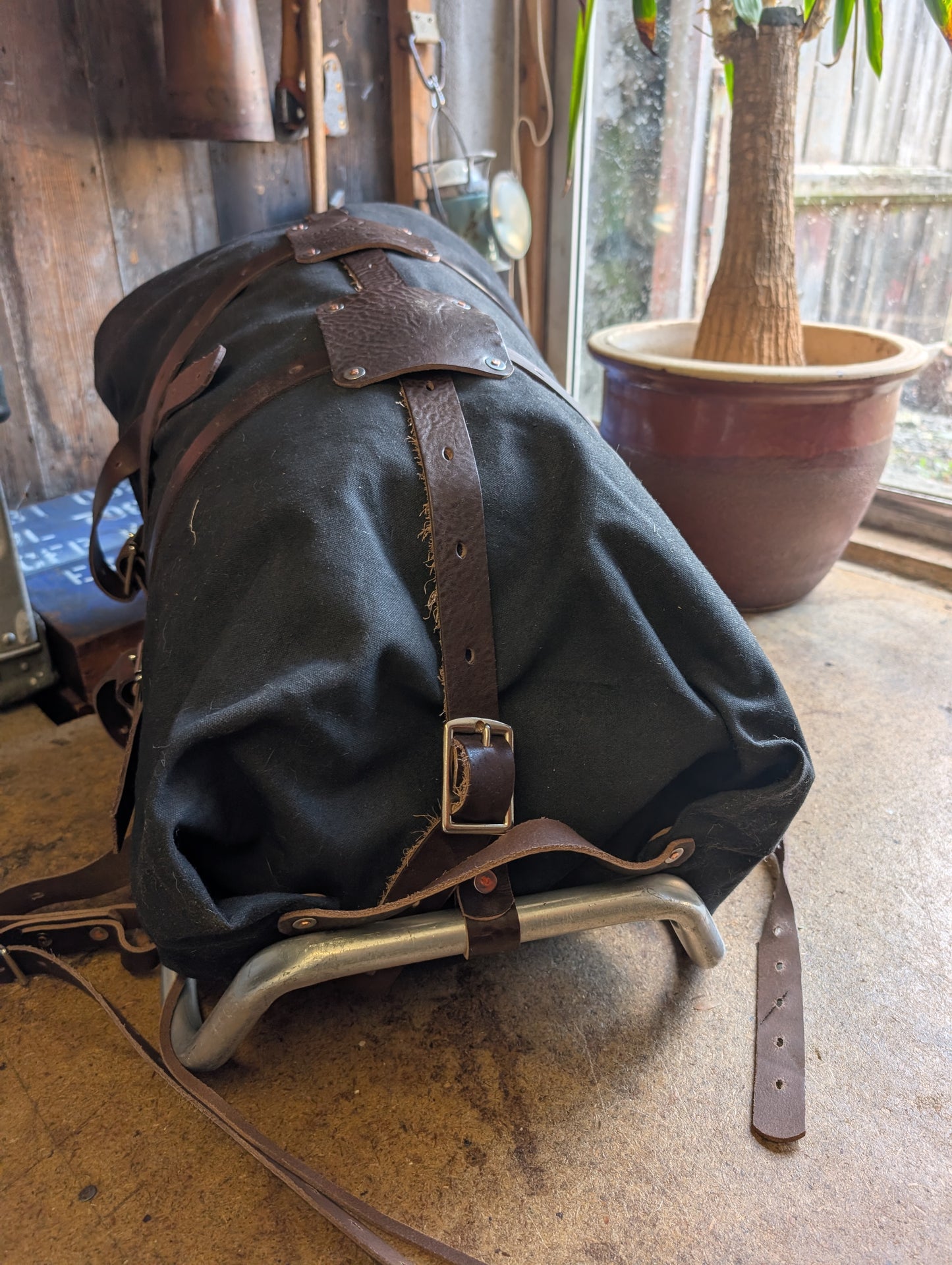 Pack basket/external frame rucksack/ gear hauler. Rebuild of vintage aluminium frame pack with leather , wool and rivets