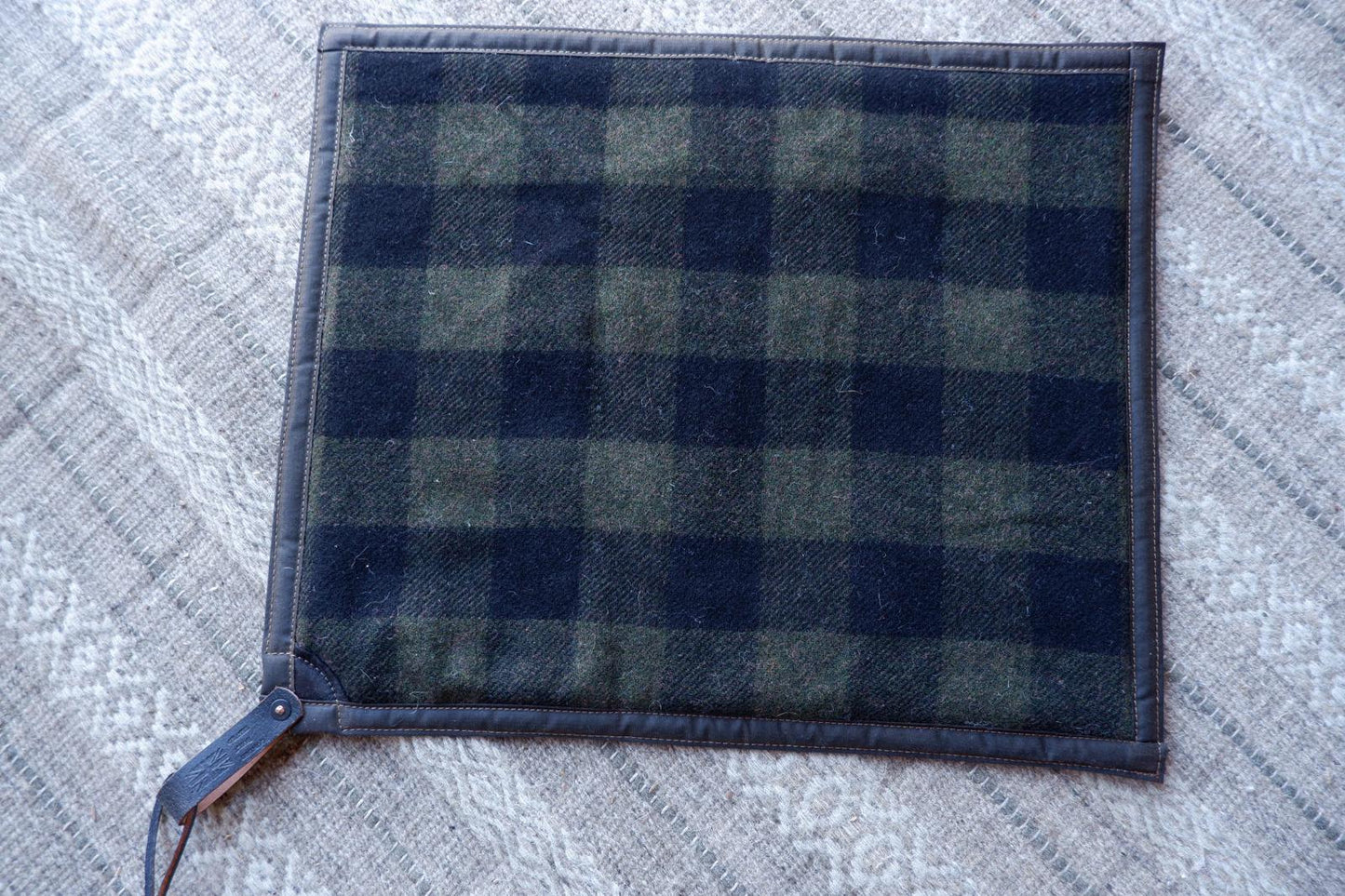 Padded sit-pad, checked wool & waxed canvas with leather tie-out