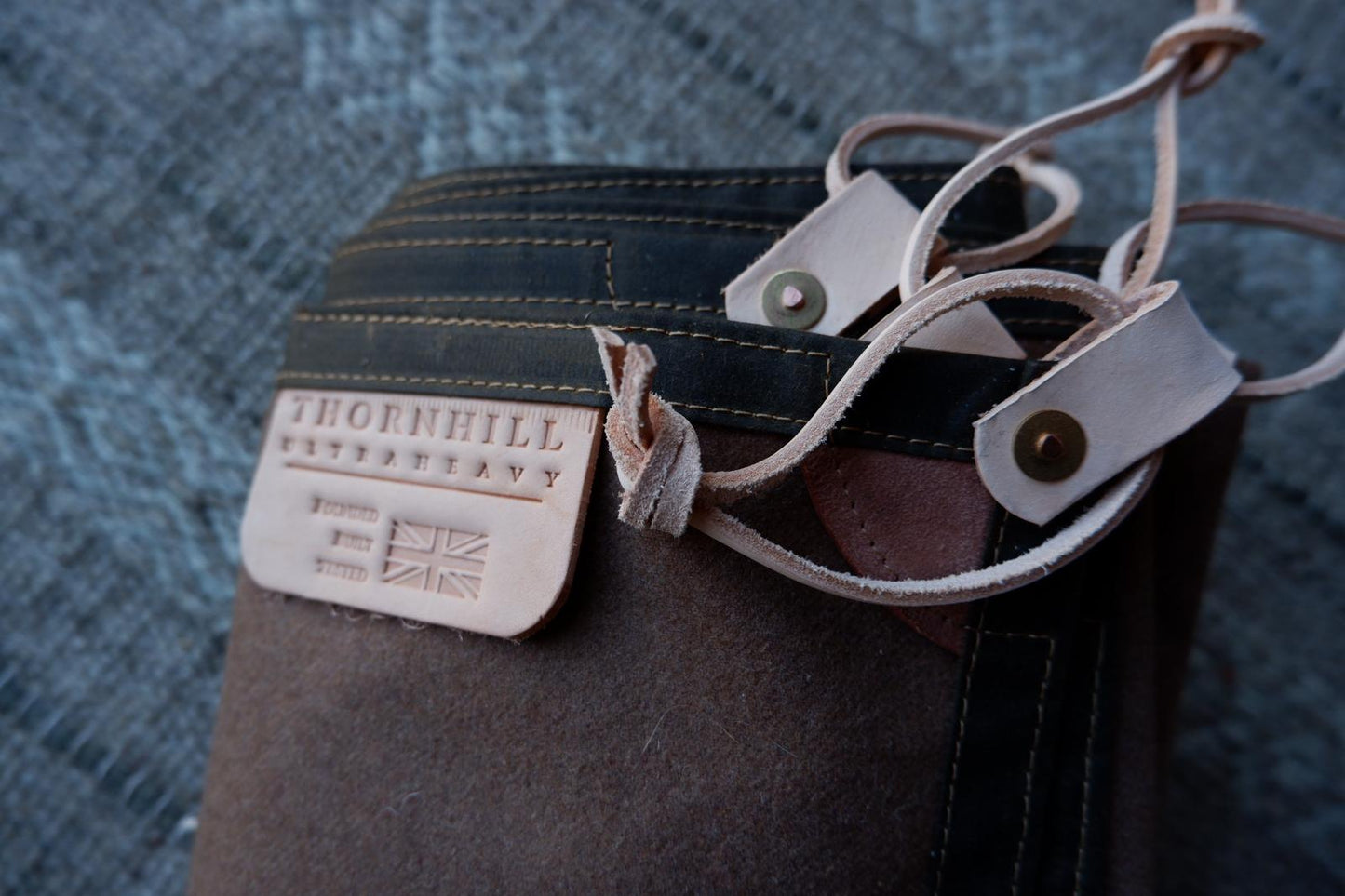 Wool lined sit-pad, waxed canvas-backed with leather tie-outs