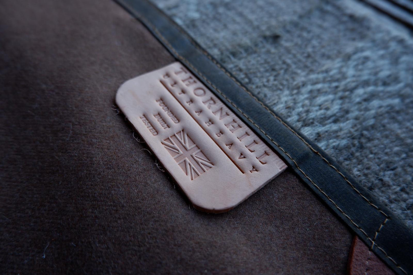 Wool lined sit-pad, waxed canvas-backed with leather tie-outs