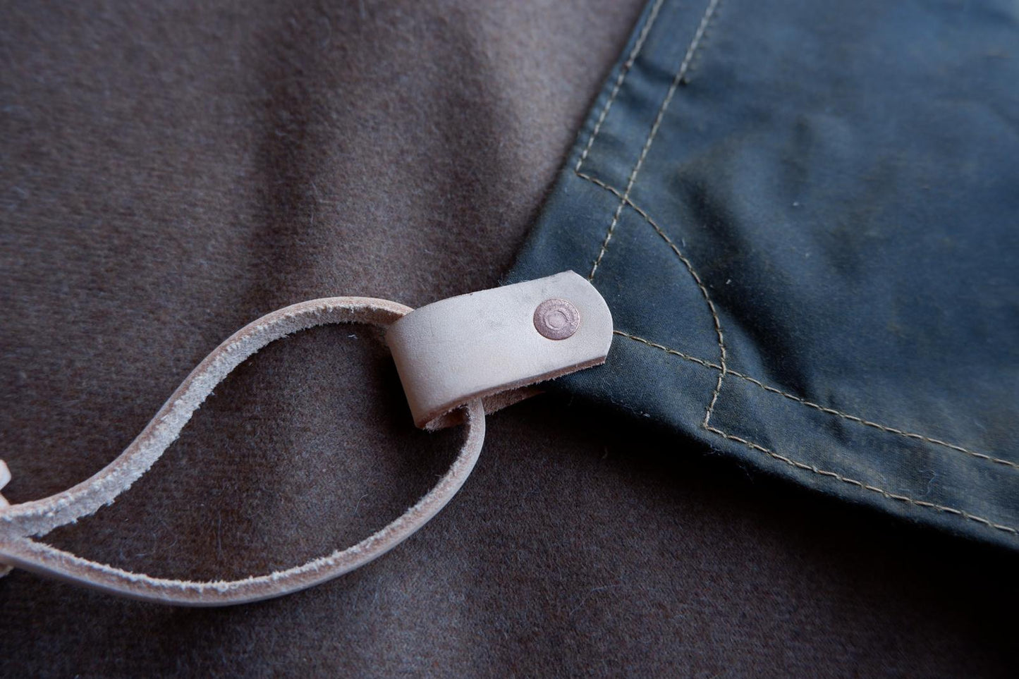 Wool lined sit-pad, waxed canvas-backed with leather tie-outs