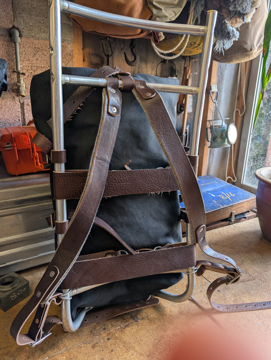 Pack basket/external frame rucksack/ gear hauler. Rebuild of vintage aluminium frame pack with leather , wool and rivets